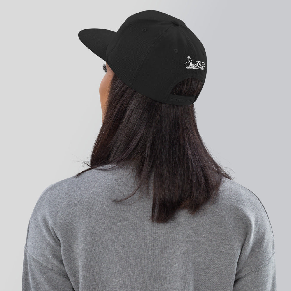 SheDope in White Snapback Hat