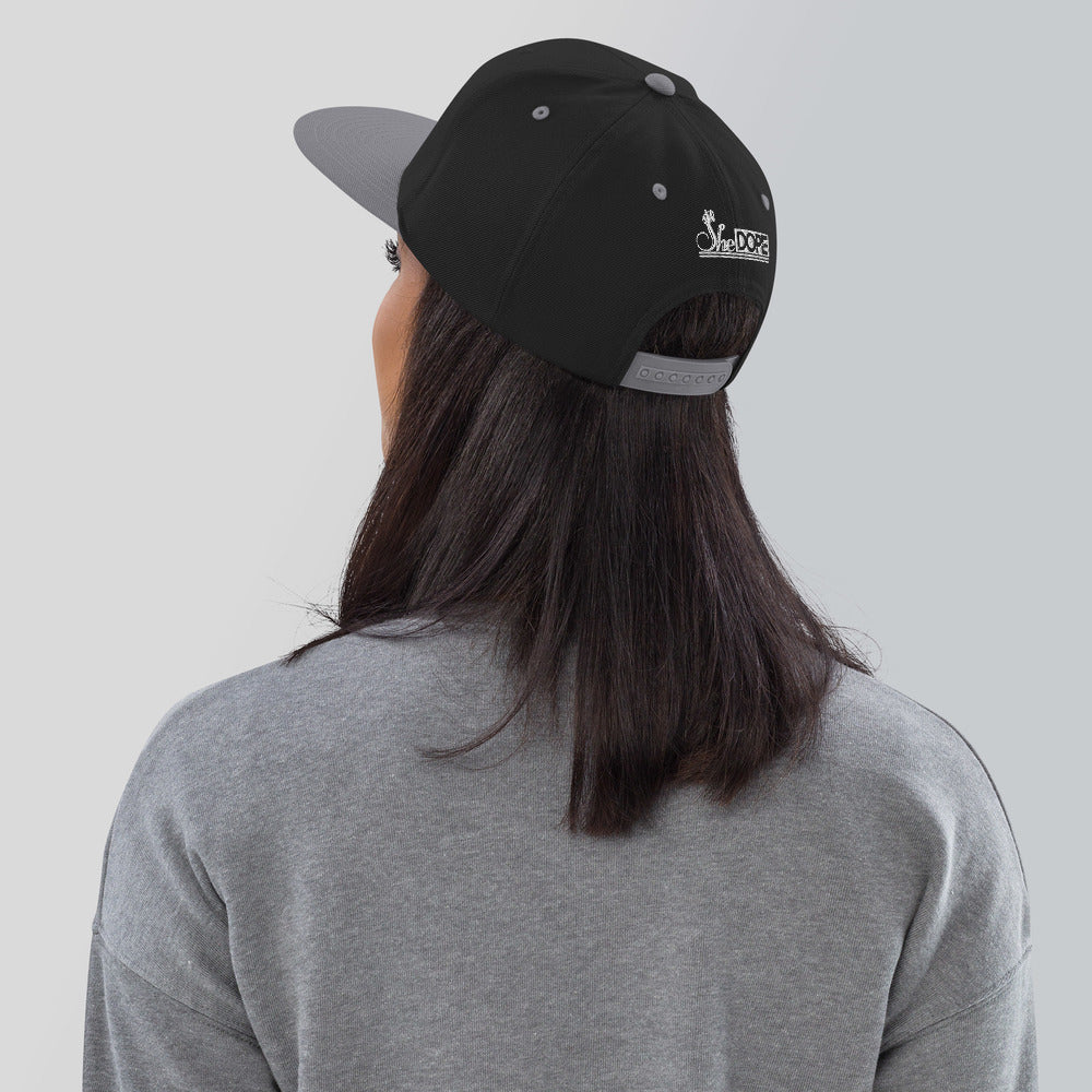 SheDope in White Snapback Hat
