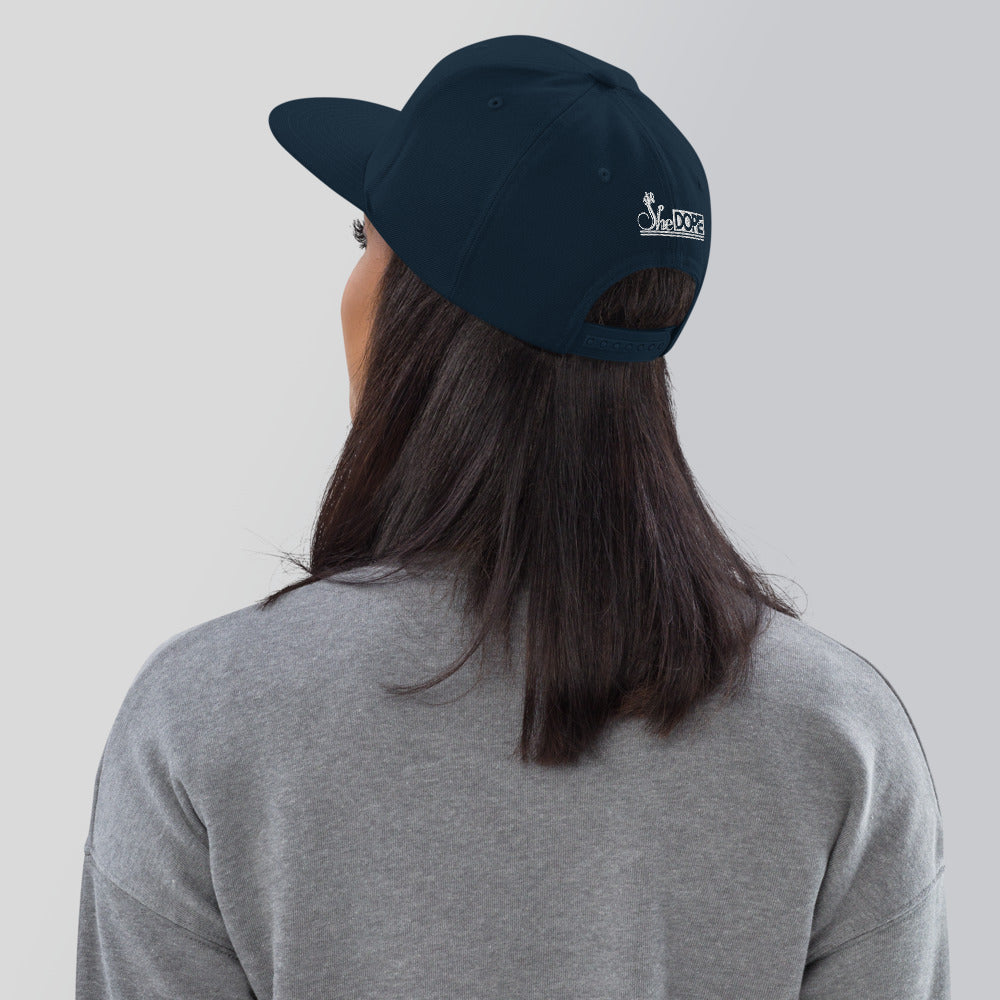 SheDope in White Snapback Hat