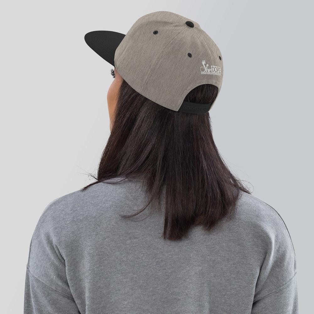 SheDope in White Snapback Hat