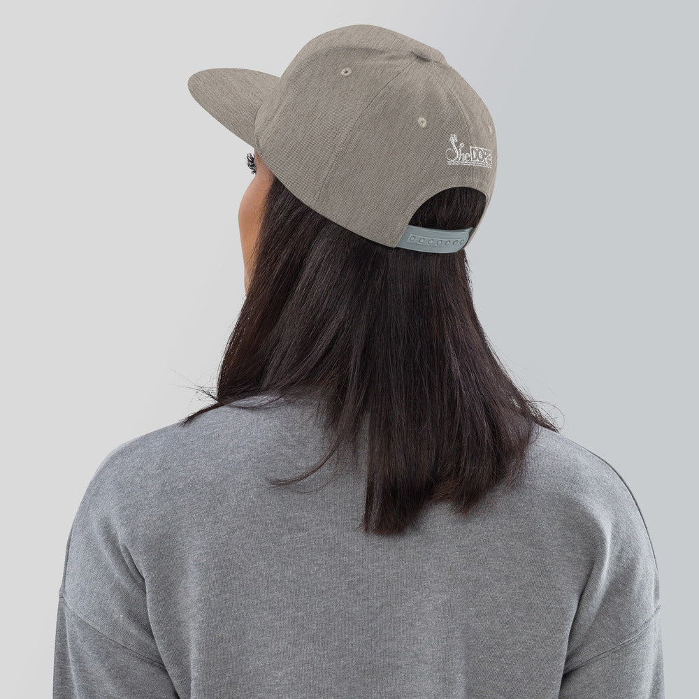 SheDope in White Snapback Hat