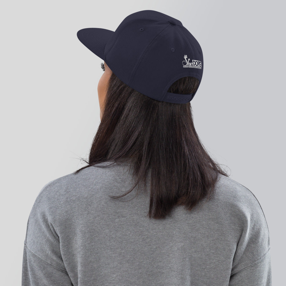 SheDope in White Snapback Hat