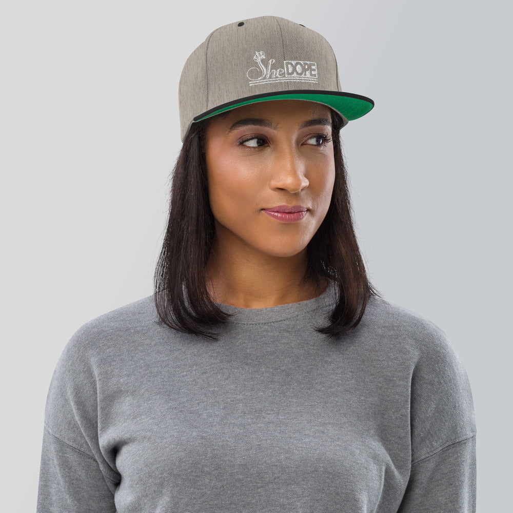 SheDope in White Snapback Hat