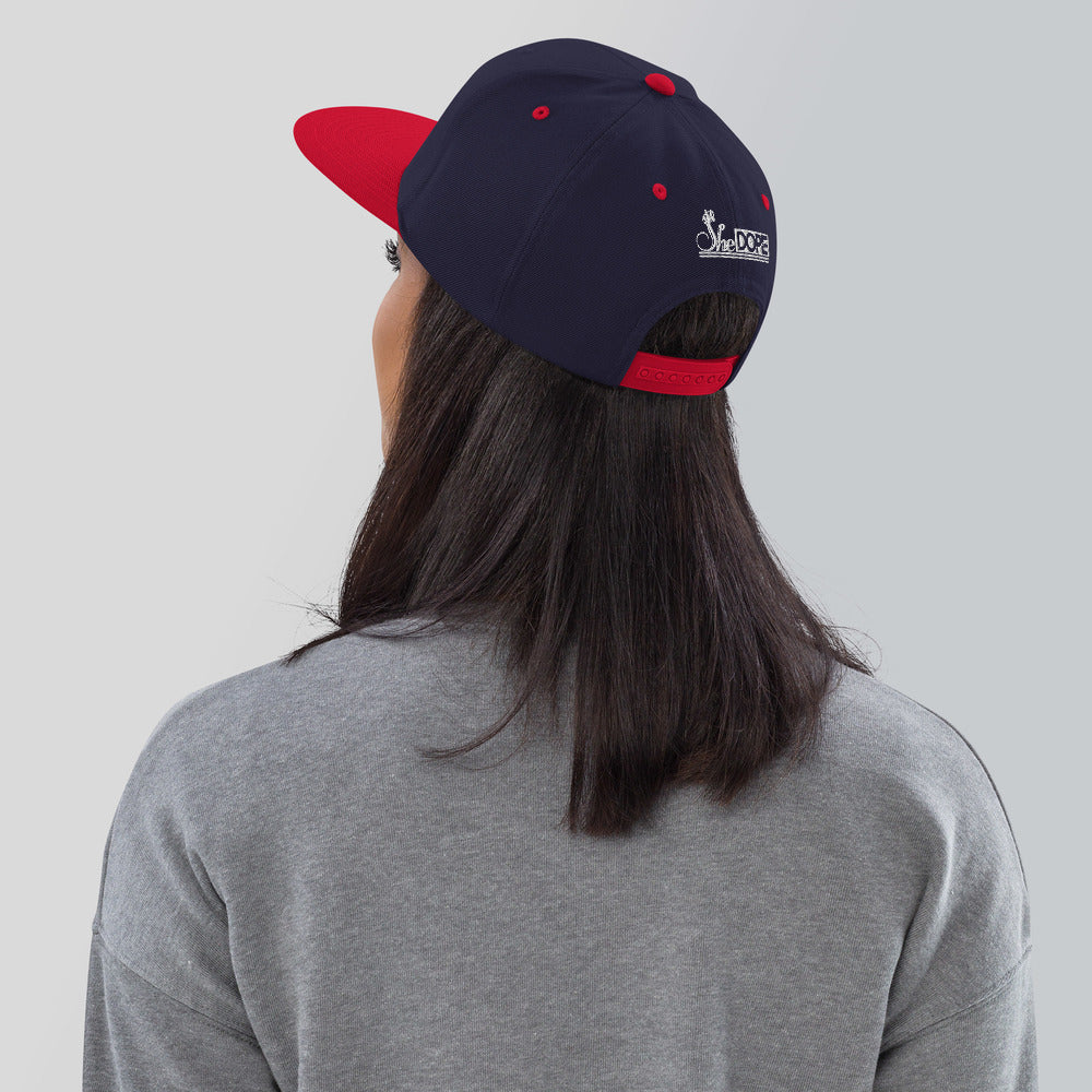 SheDope in White Snapback Hat