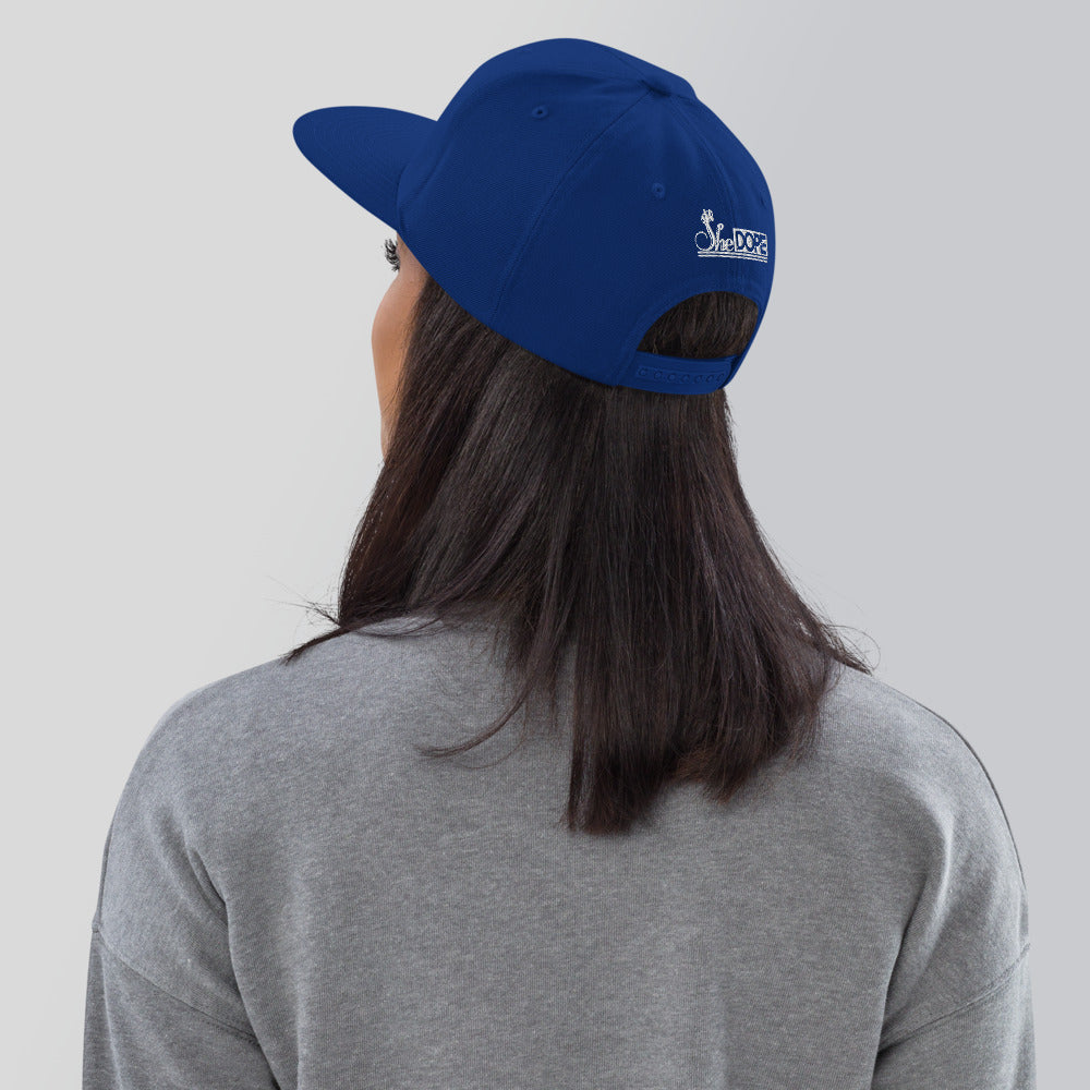 SheDope in White Snapback Hat