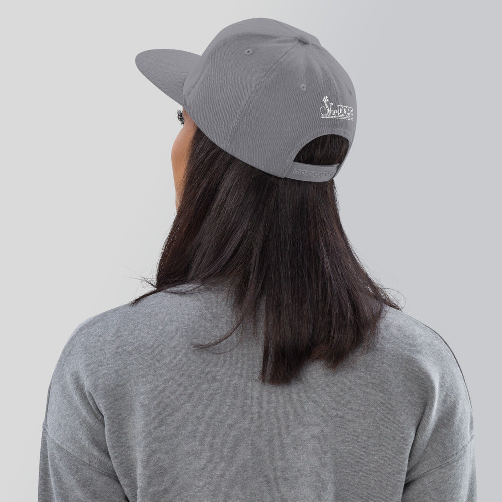 SheDope in White Snapback Hat
