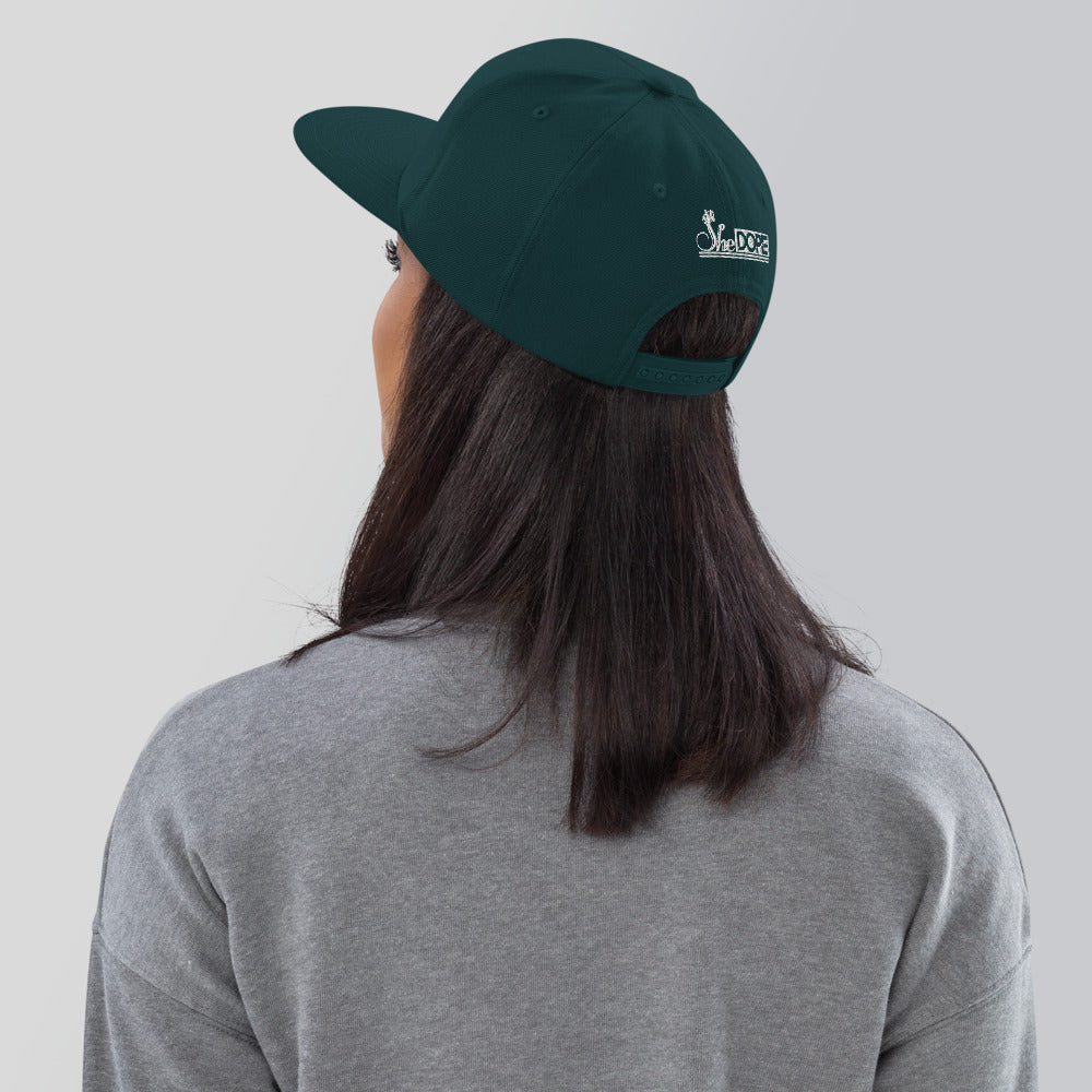 SheDope in White Snapback Hat